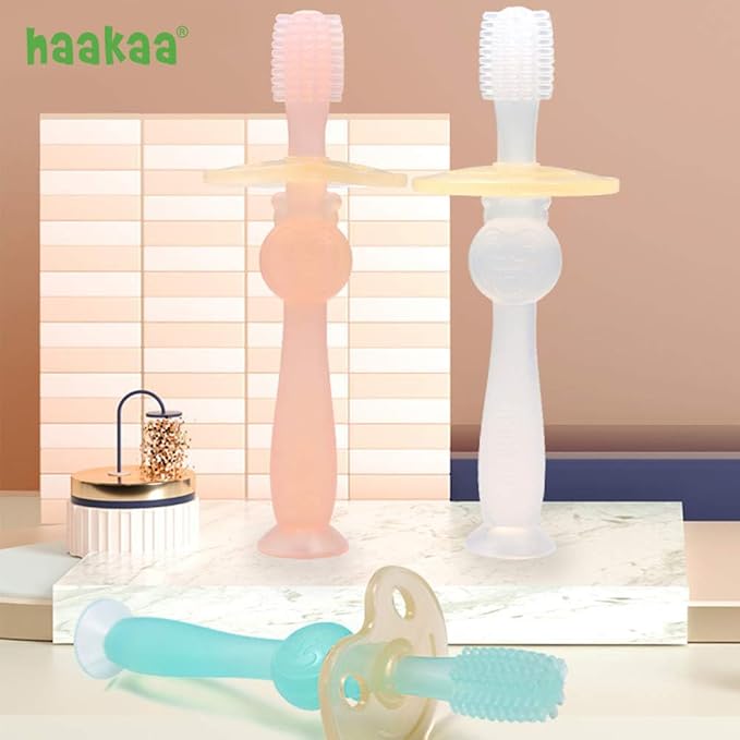 haakaa 360° Baby Toothbrush with Suction Base - Gentle Cleaning for Toddler's Self-Brushing Training, Food-Grade Silicone, Adjustable Safety Shield - Pink (1 Piece)