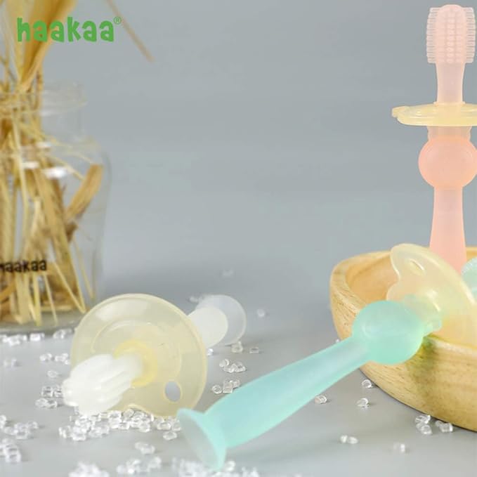 haakaa 360° Baby Toothbrush with Suction Base - Gentle Cleaning for Toddler's Self-Brushing Training, Food-Grade Silicone, Adjustable Safety Shield - Pink (1 Piece)