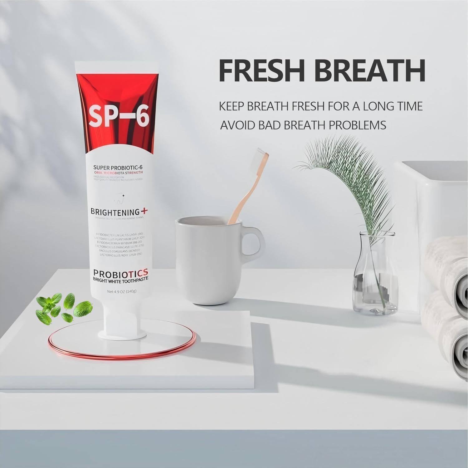 SP-6 toothpaste tube with a cup and mint leaves on a light background