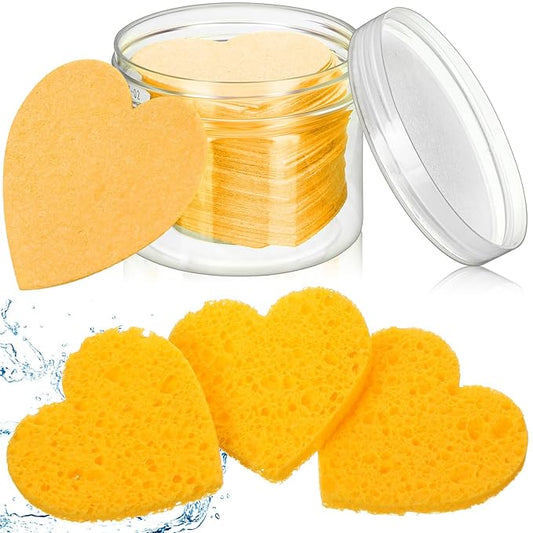 Nuenen 60 Pieces Facial Sponges with Container, Heart Shape Compressed Face Sponges Natural Cleaning Pads for Washing Face Cleaning Exfoliating Esthetician Makeup Removal(Yellow)